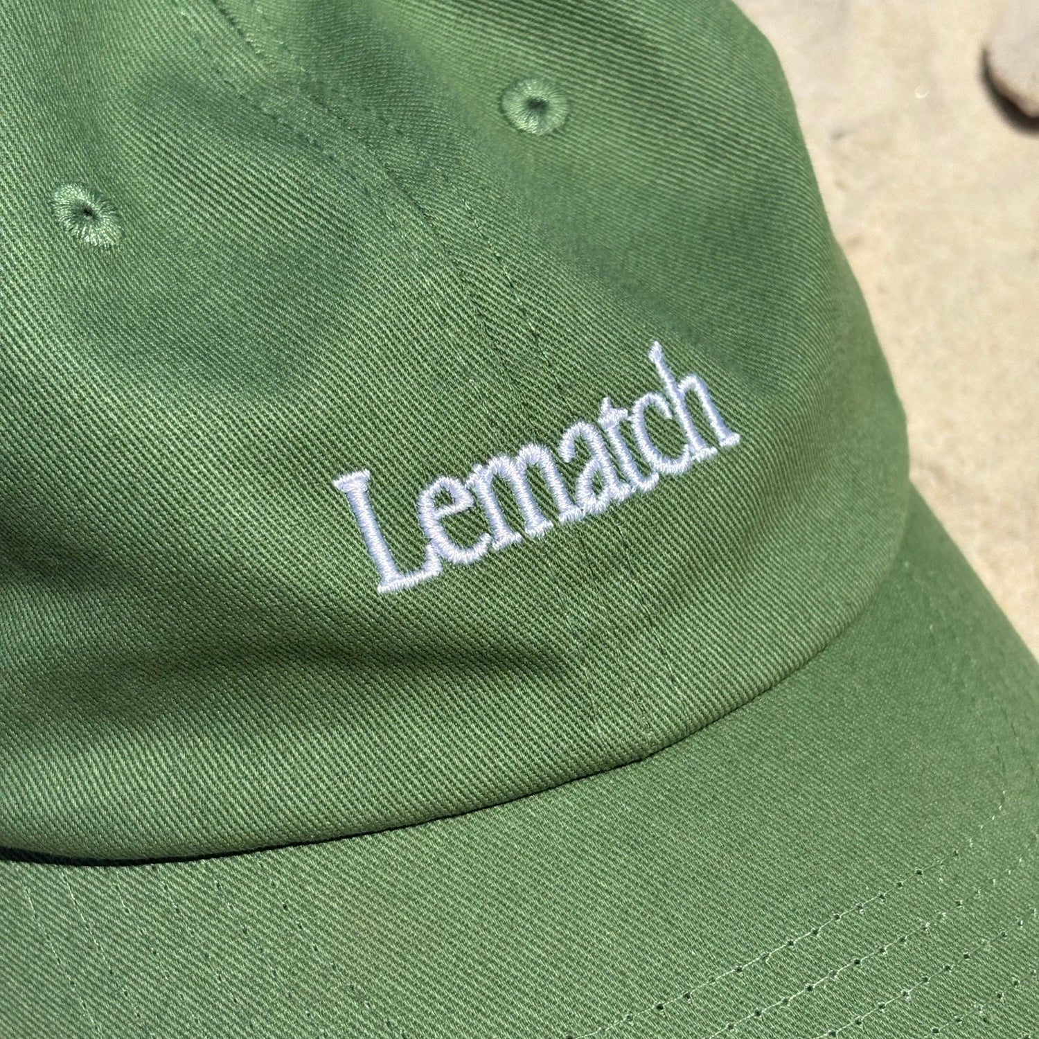 lematch green logo submark cap